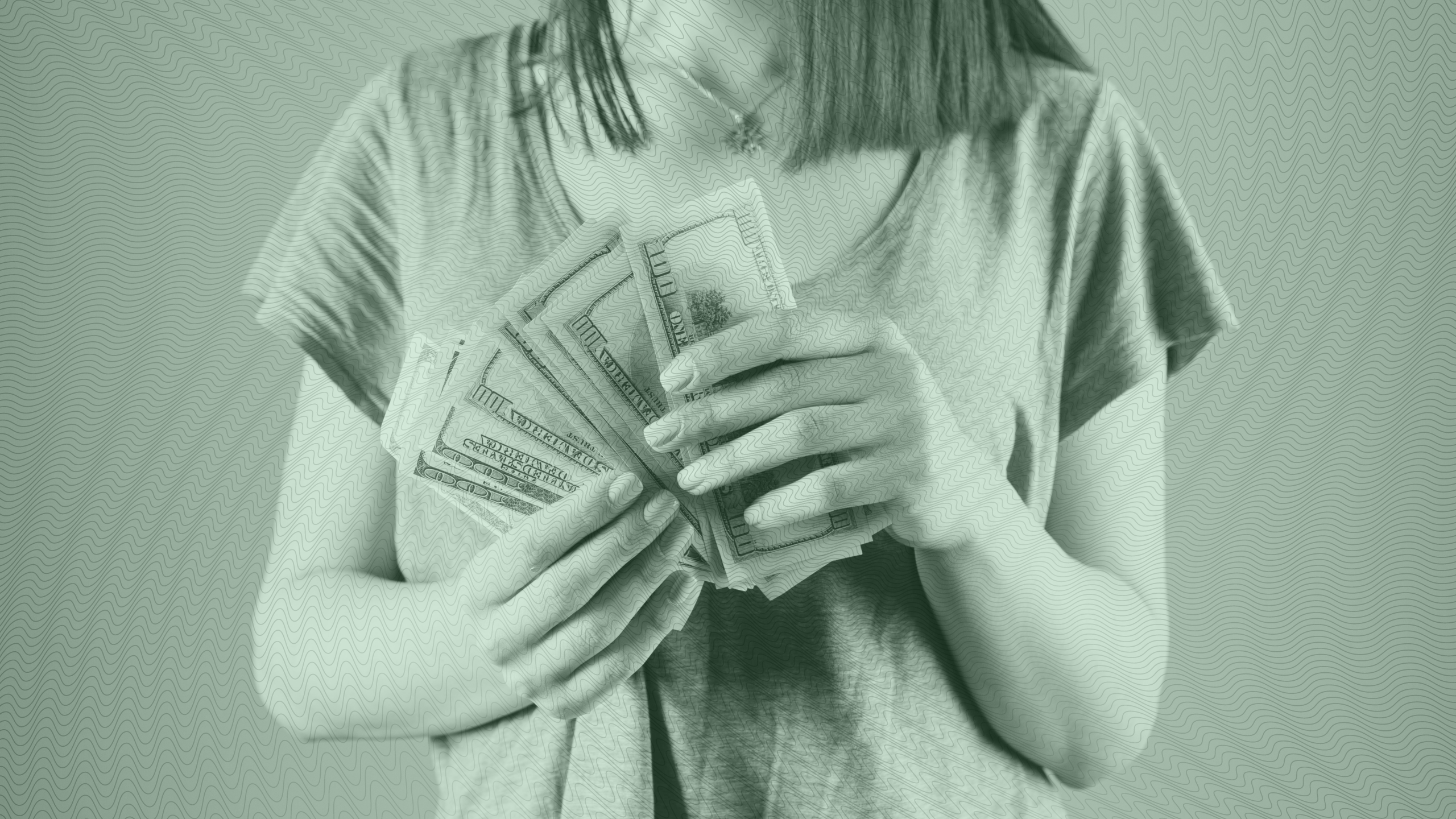 Photo of a woman counting hundred dollar bills