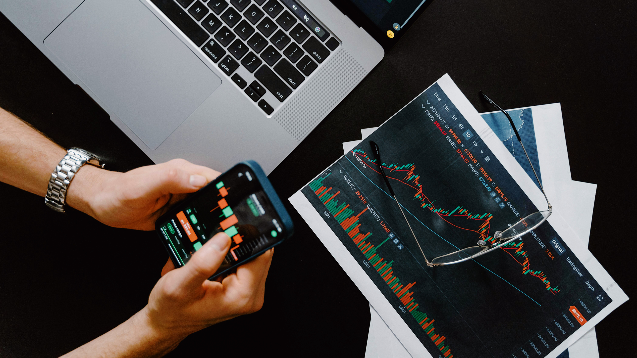 Photo of a person looking at stock charts